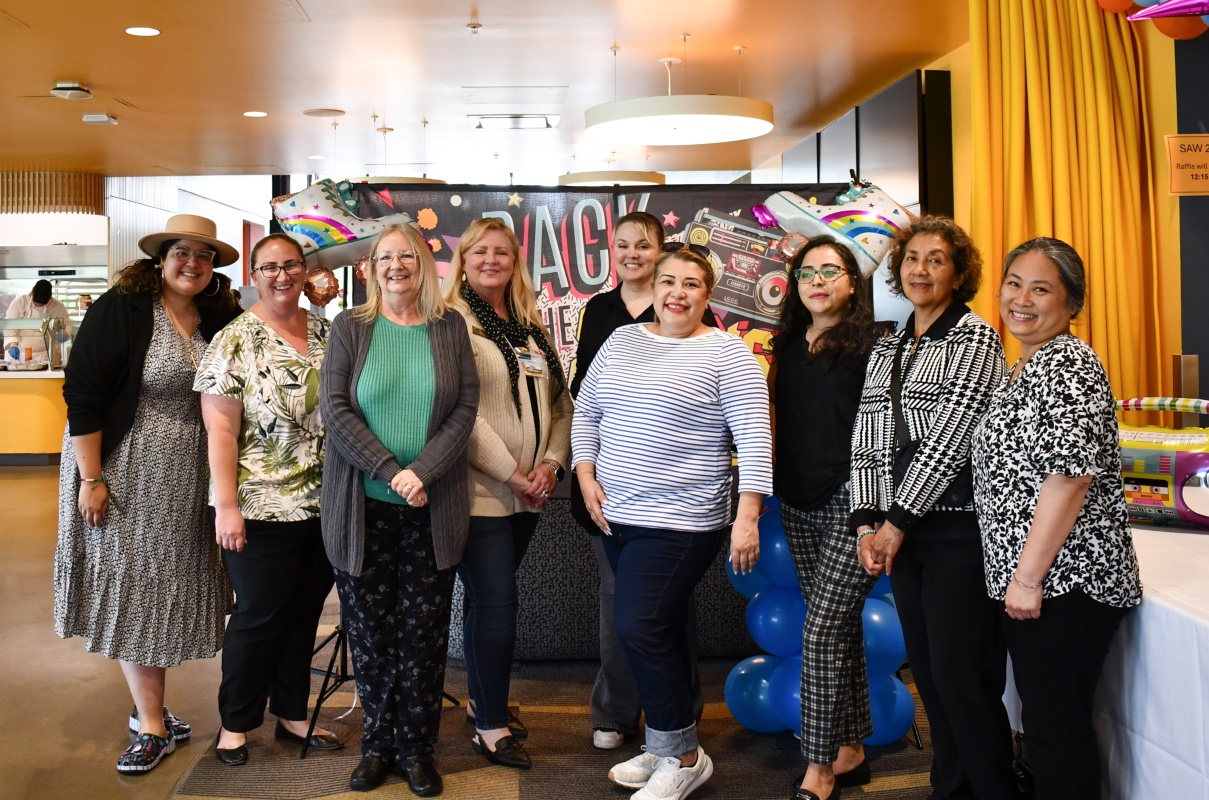 Group of Staff Council E-Board. All standing and smiling. 