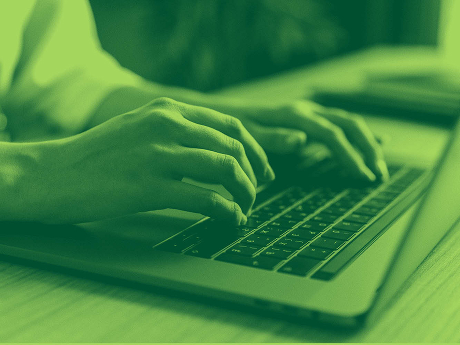 a person typing on a keyboard
