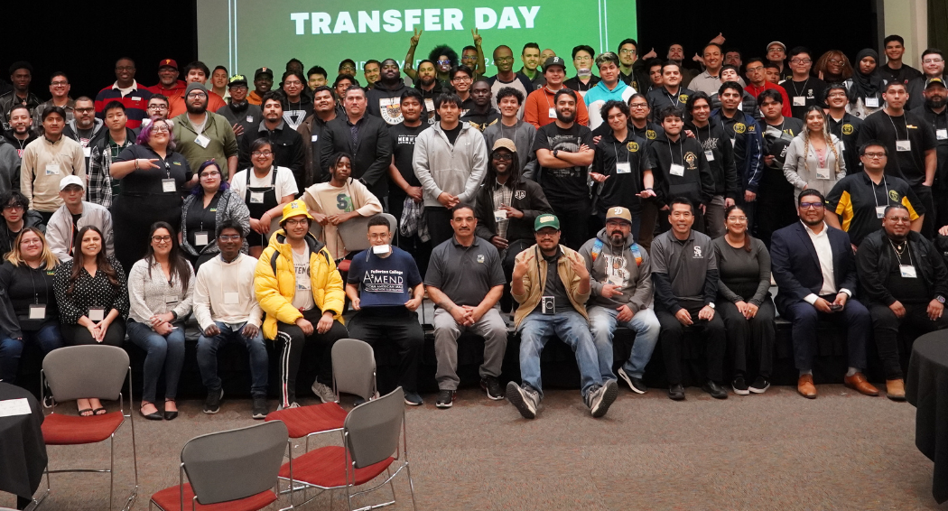 students pose at a conference
