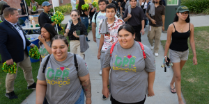 Students walk into the Quad during convocation