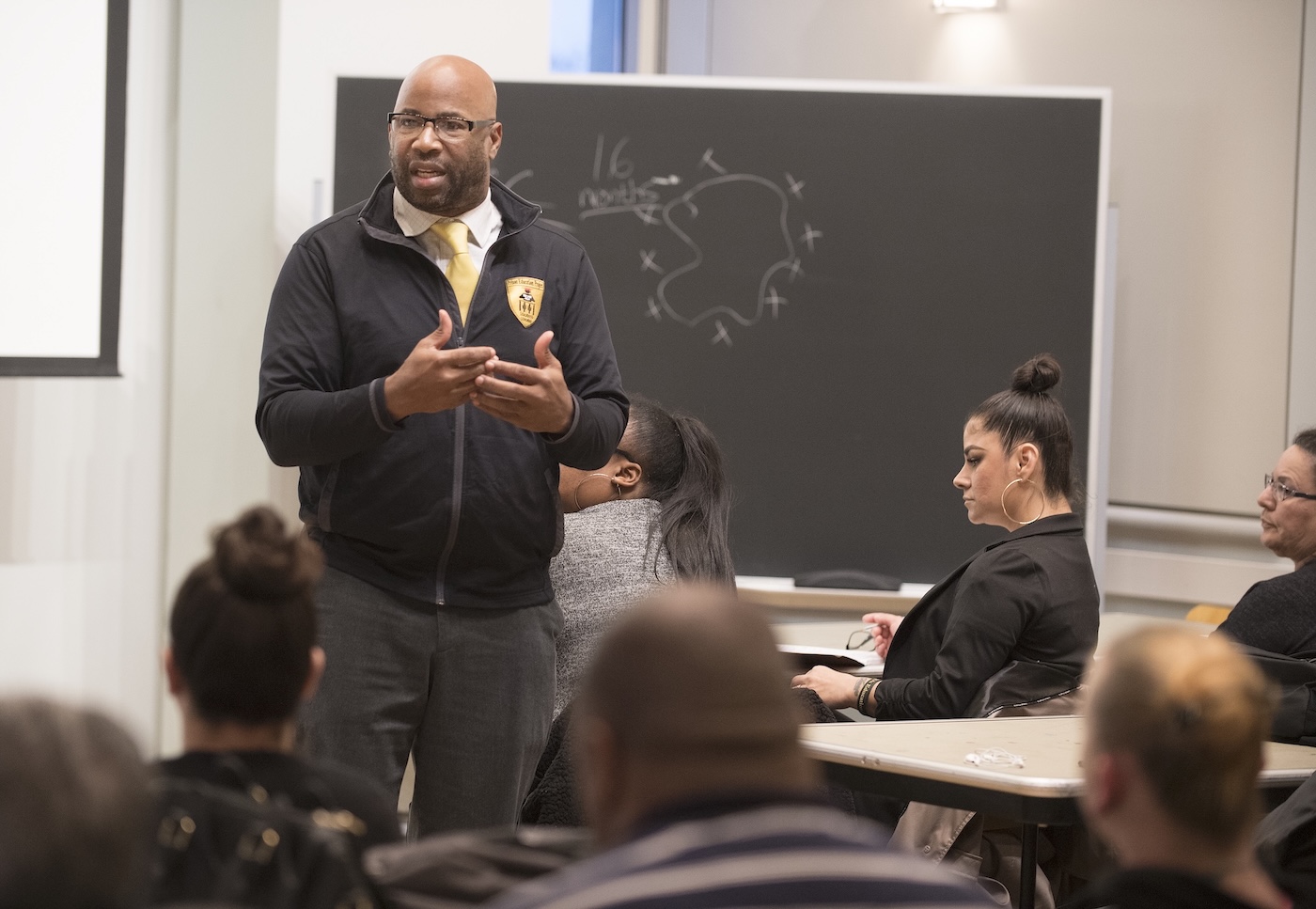 Prof. Reese speaks with Project Rebound students