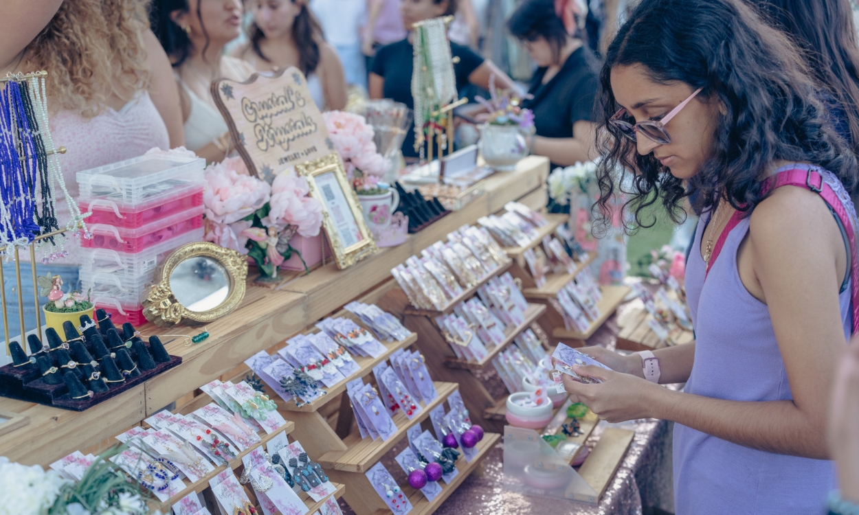 A student browses a stand at the Marketplace