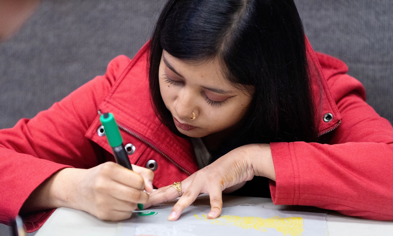 A student works on their artwork