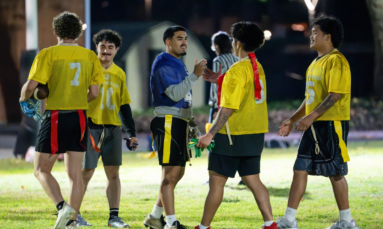 Students at a flag football game