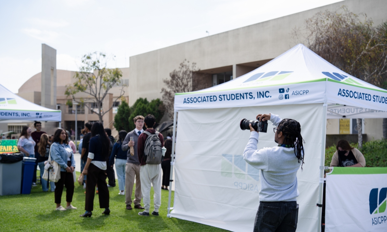 A student aims his camera to take pictures