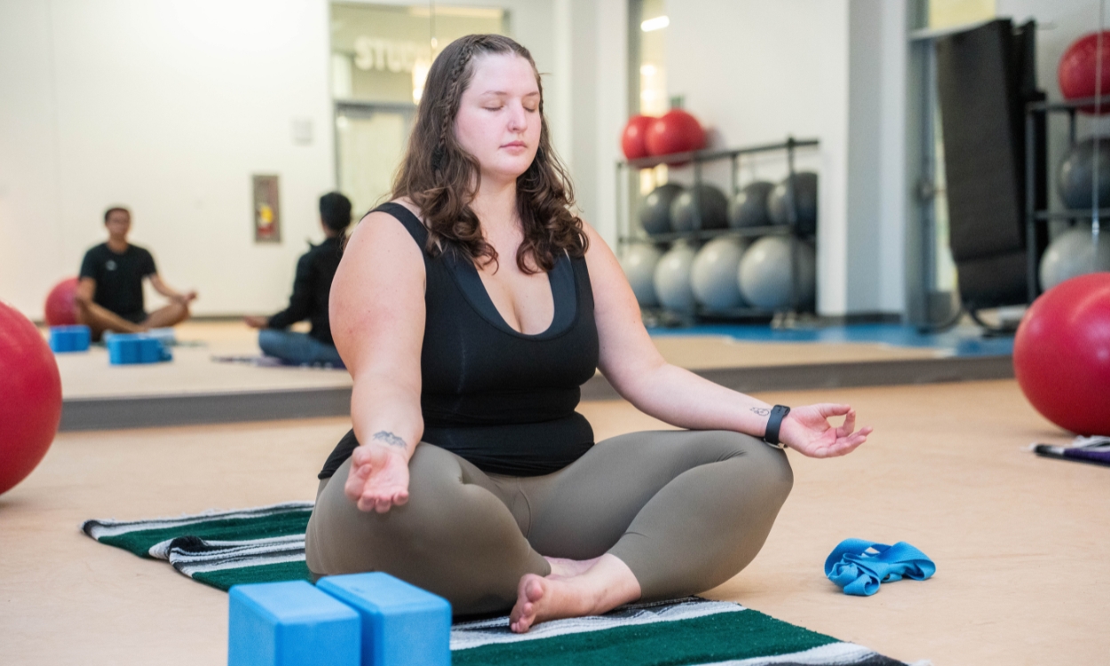 A student practices meditation in a BRIC studio