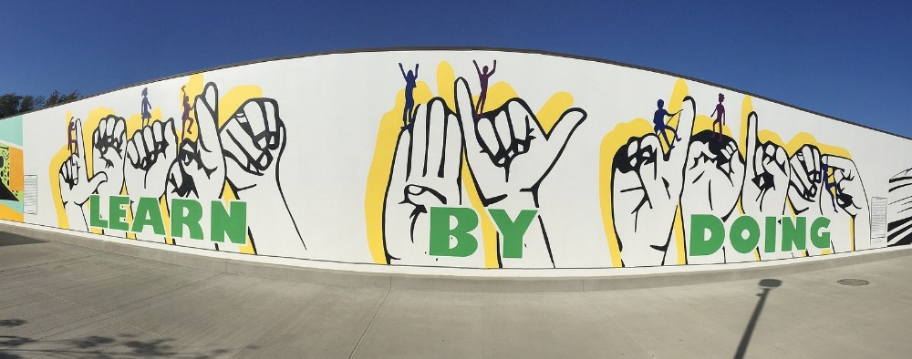 Learn By Doing Mural with sign language descriptors