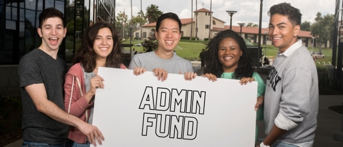 Students hold up poster reading 'Admin Fund'