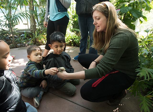 A parent interacts with children