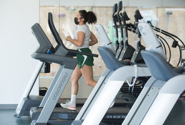 Student runs on a treadmill