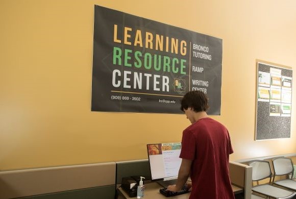 A student checks into a computer at the Learning Resource Center 