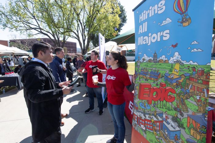 Student talks to recruiter at career fair