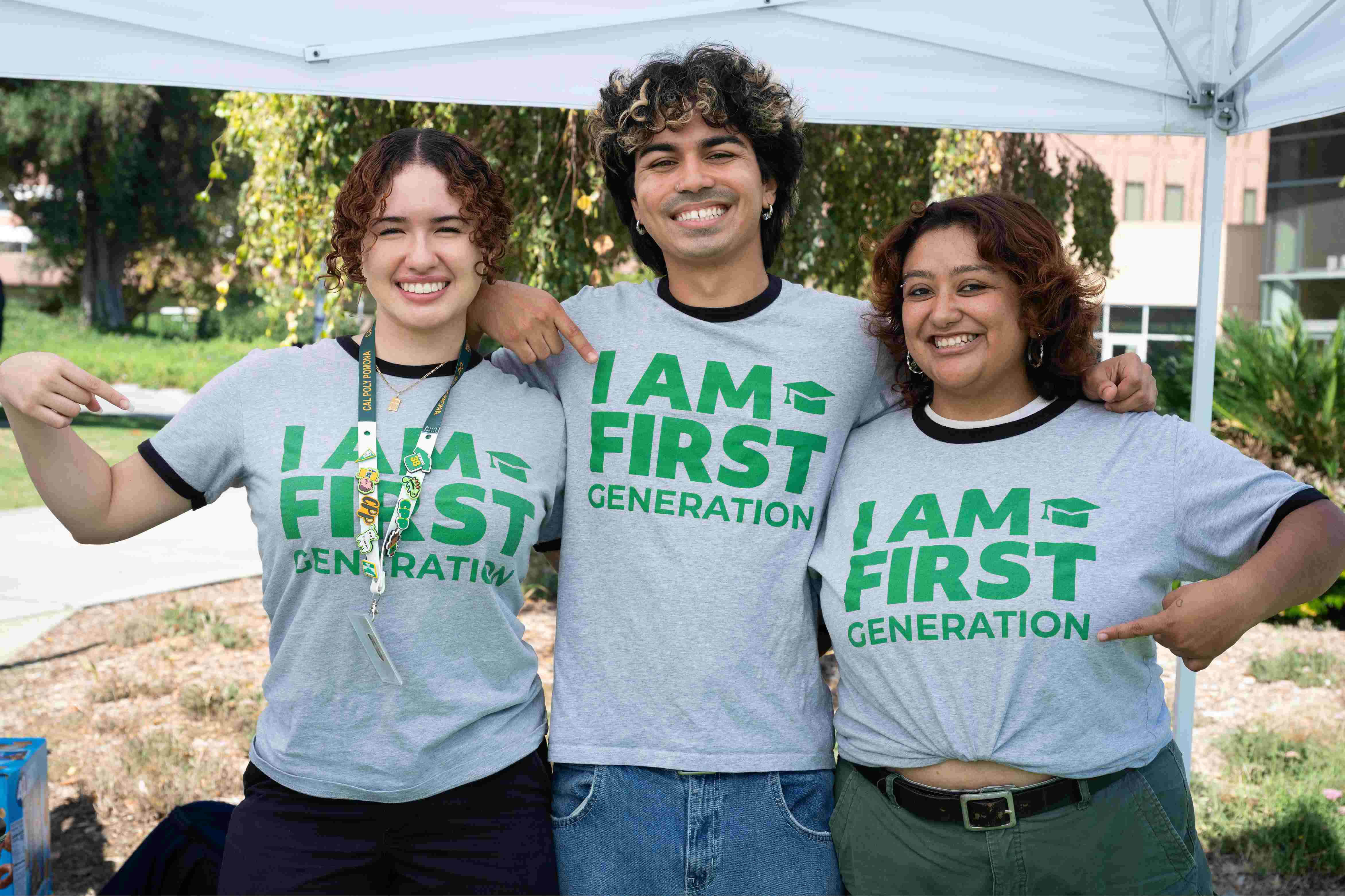 Student holding I Am First Generation T-shirt