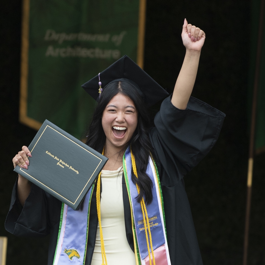 Asian student cheers at Commencement