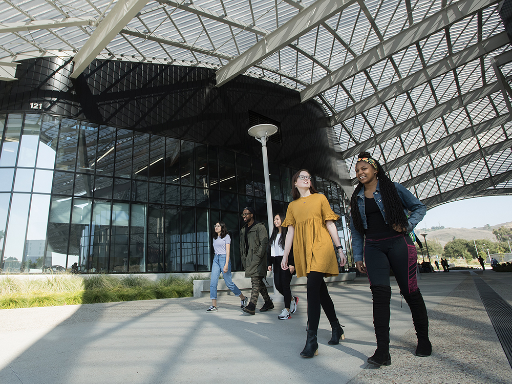 Two students walking in the Student Services Building