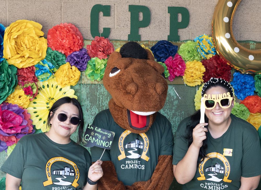 Project CAMINOS members pose at photo booth