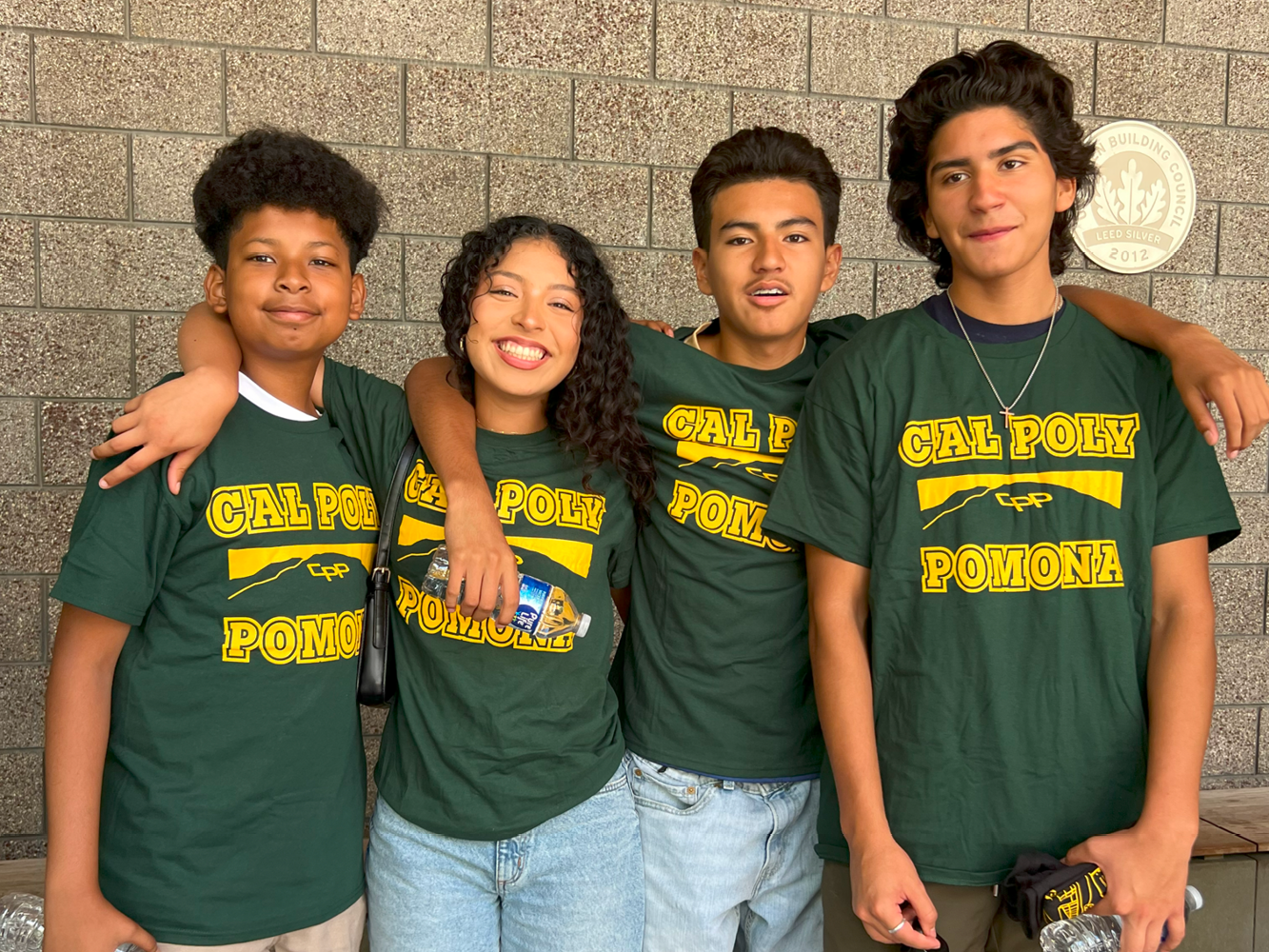 Students pose for a group photo on the CBA steps