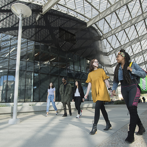 Students walking through the Student Services Building