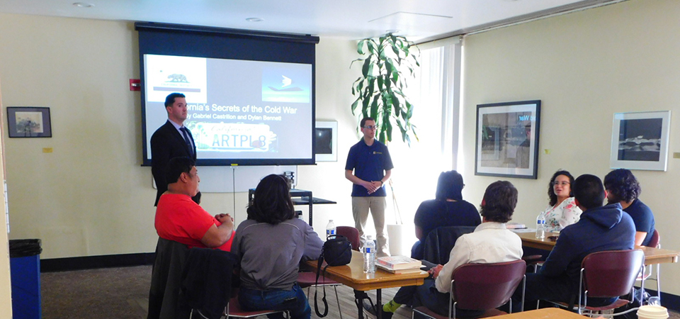 Dylan Bennett and Gabriel Castrillon present to a group