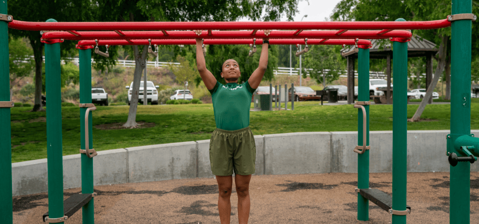 photo of eliana working out on bars