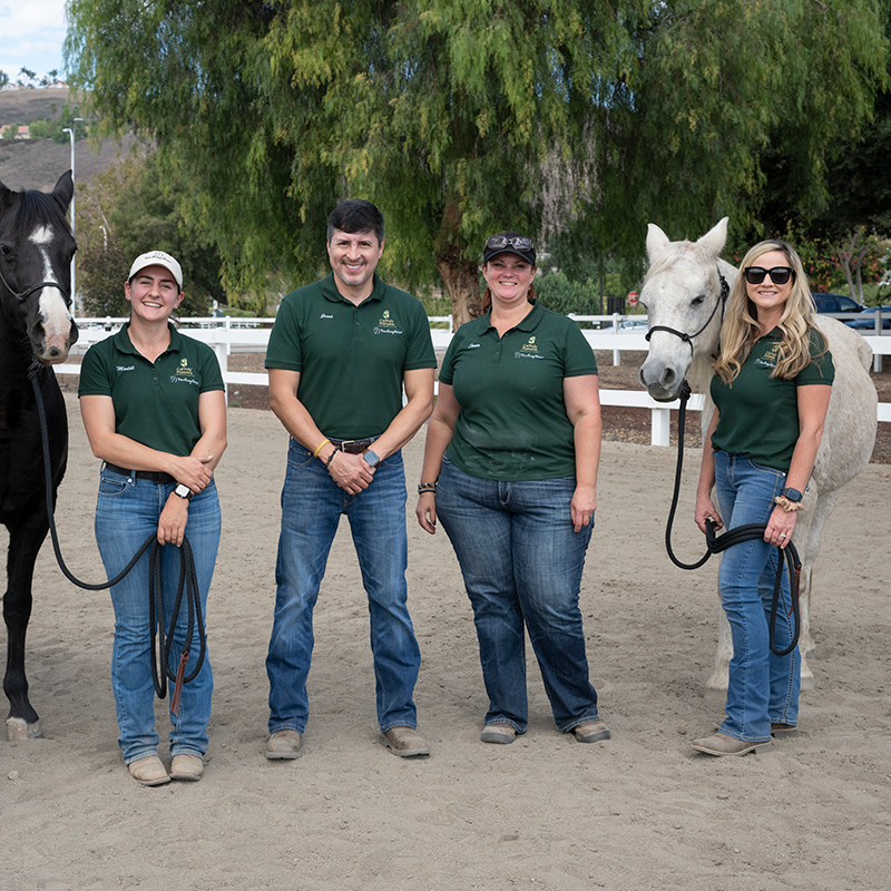 Facilitators of TeachingHorse program and two horses.