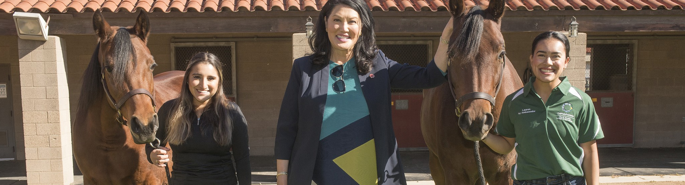 CSU Trustee Wenda Fong pictured with two Cal Poly bred Arabians and students