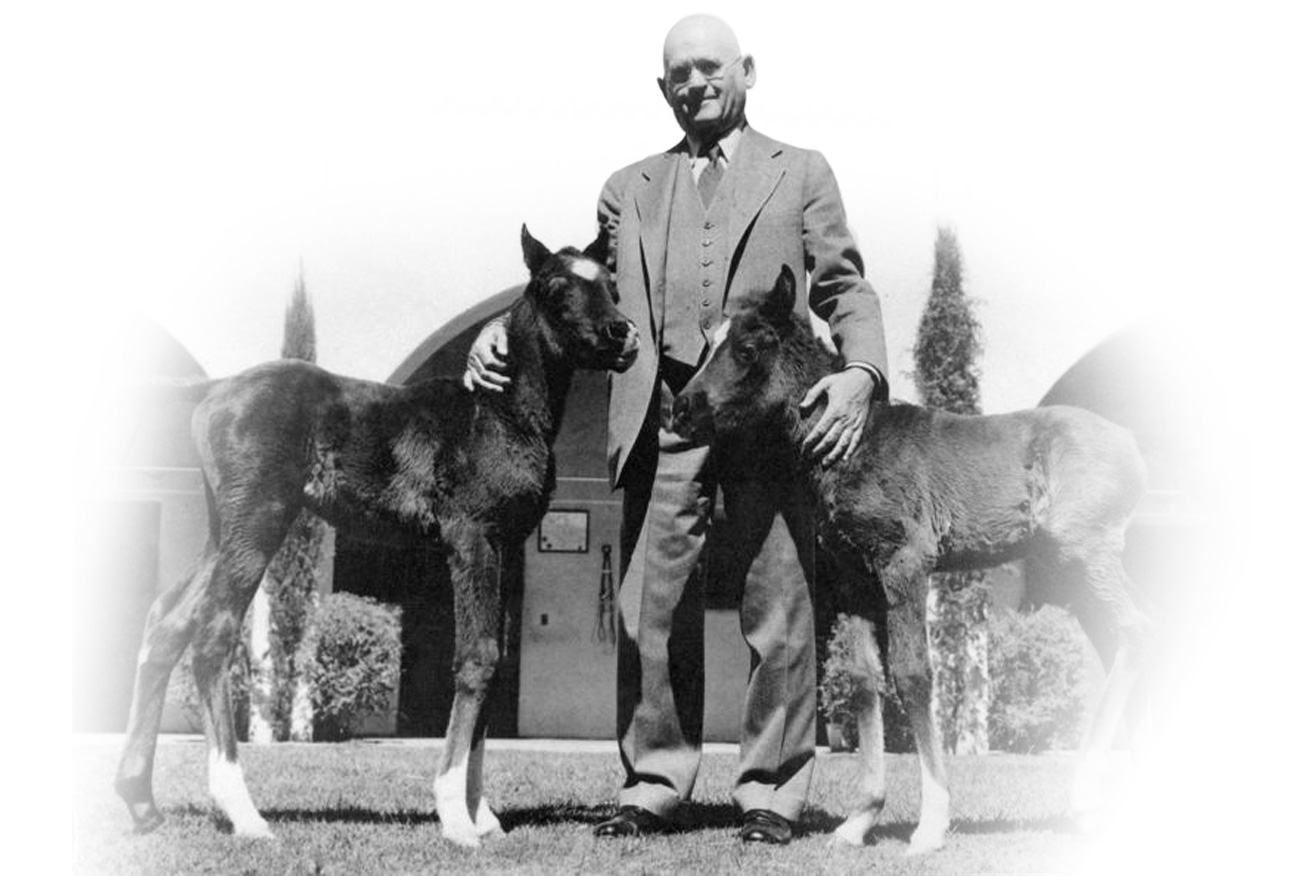W.K. Kellogg and two Arabian Foals
