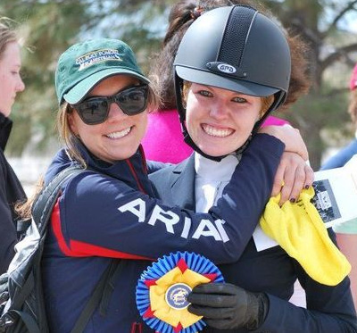 a woman hugs another woman colleague holding badge icon