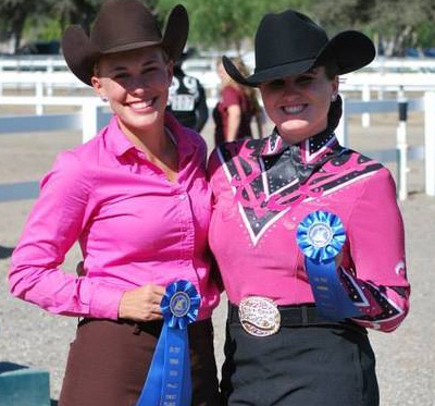 two women hold winning badges icon