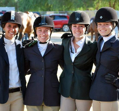 four equestrian woman smile for the camera icon