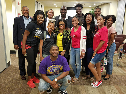 Black Alumni Chapter members with students and Dr. Coley.