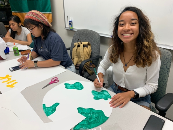 Students craft posters in preparation for the Global Climate Strike.