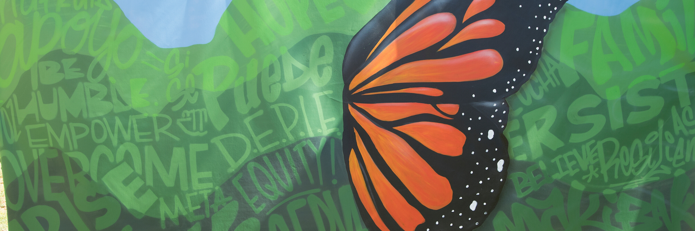 Mural created for undocumented students, including words of solidarity and a butterfly