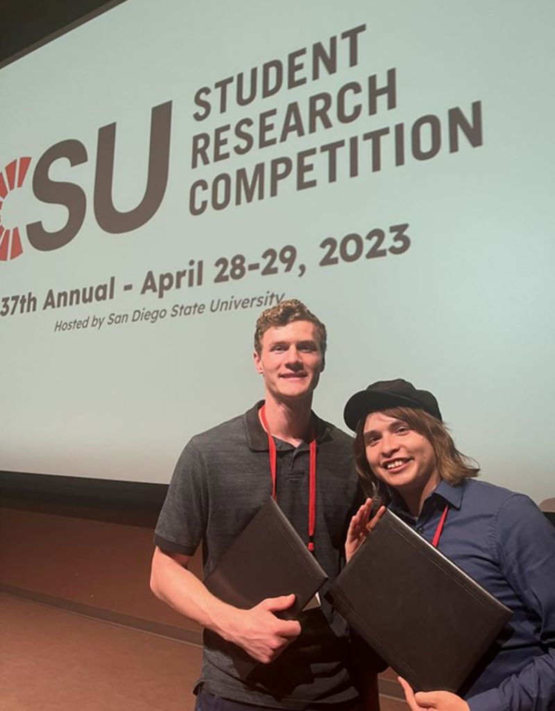 Two civil engineering students from Cal Poly Pomona at a CSU research competition conference.