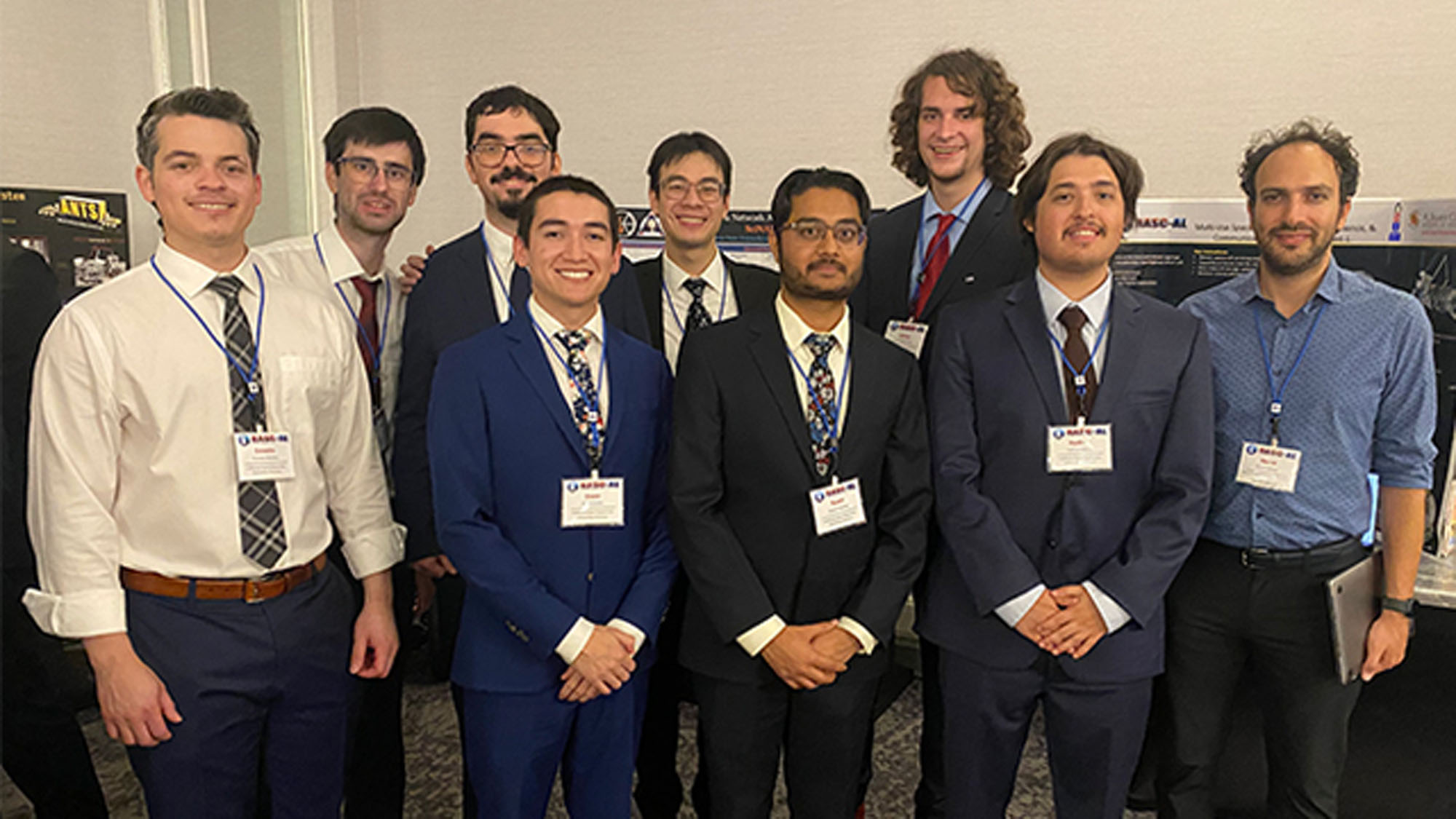 A group of Cal Poly Pomona aerospace engineering students at a research conference.