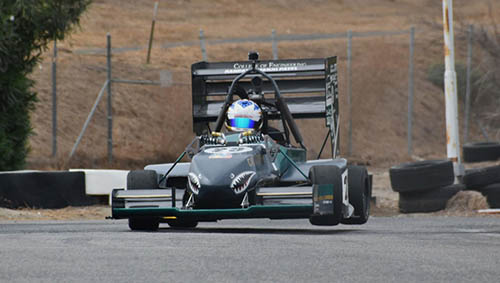 Bronco Motosports formula vehicle racing down a track.