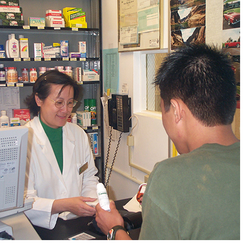 pharmacist explaining medication to patient