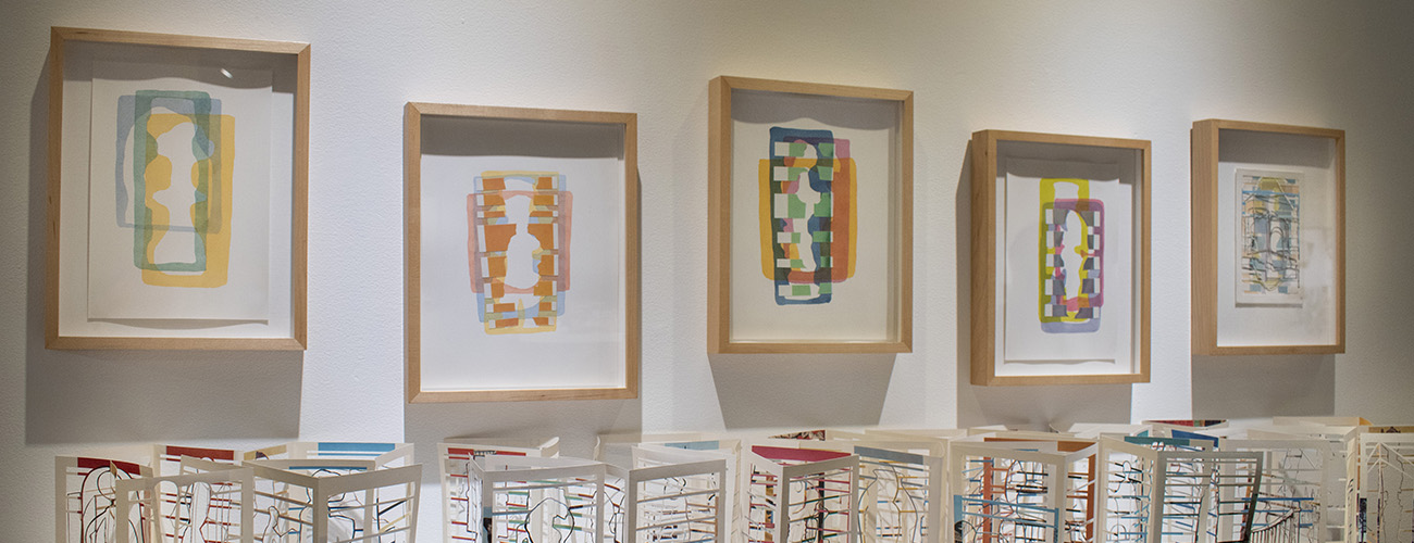 Courtesy of artist Susan Sironi, "Appropriation," 2019-2020. Deconstructed book, watercolor paintings and collages, 16x5x5’ approximately. Photo Credit: Bill Gunn, Wolverine Photography.