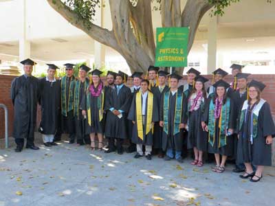students in their cap and gowns during commencement
