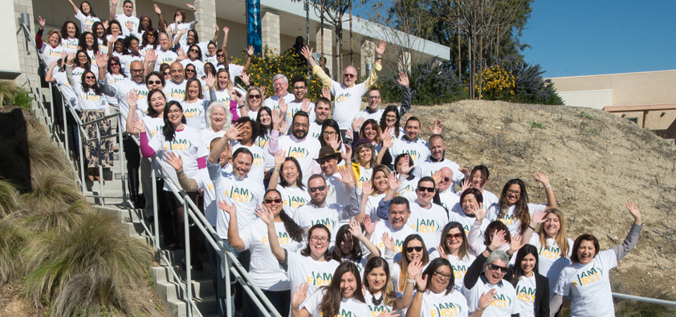 Group photo of faculty and staff wearing I AM FIRST t-shirts