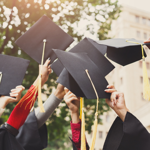 Higher Education - graduation caps raised