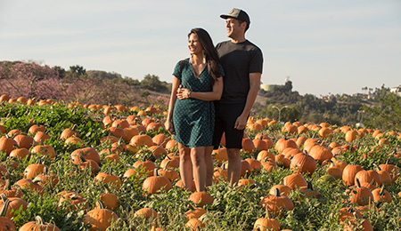 A couple poses for a photo at the Cal Poly Pomona pumpkin patch