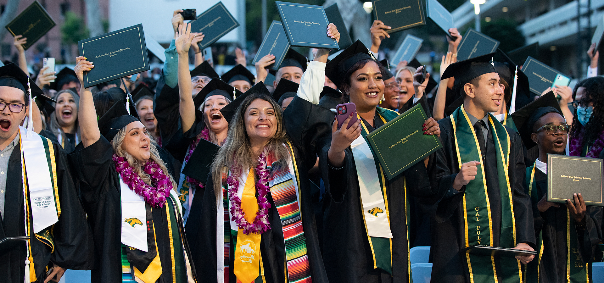 Graduates from the CLASS ceremonies celebrate during commencement.
