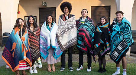 A group of Native American Students pose for a photo.
