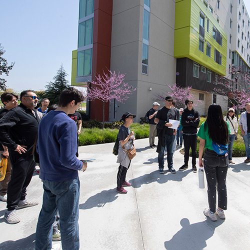 A group of parents and prospective students on a campus tour.